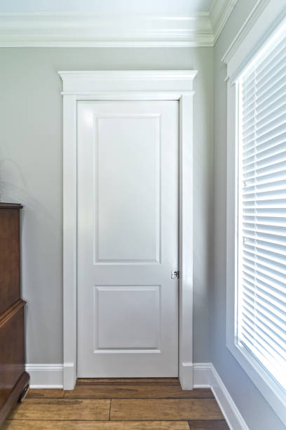istock a bathroom or closet closed white door in a new construction house 1448376362