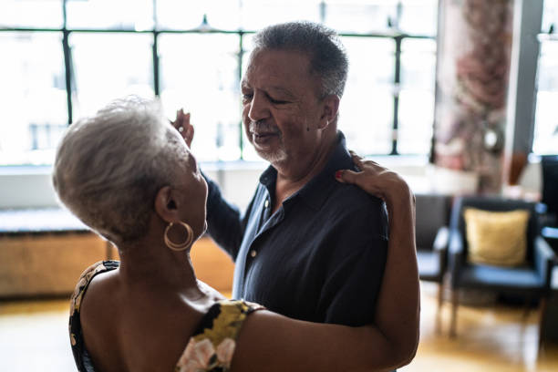 istock Senior couple dancing waltz in dance hall 1448376373