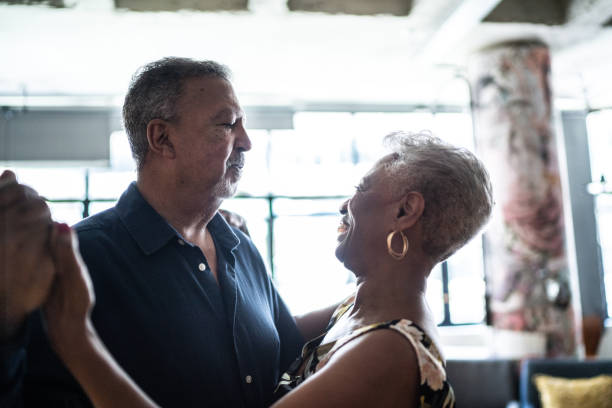 istock Senior couple dancing waltz in dance hall 1448376386