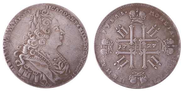 A silver coin of the 18th century Russia with a nominal value of one ruble 1727