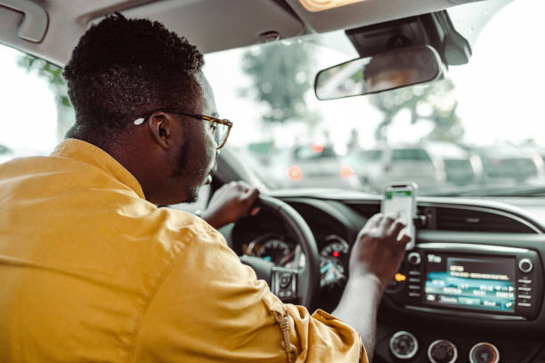 istock Uber driver checks his smart phone 1448382139