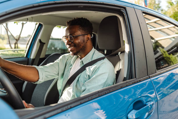 istock Cheerful male driver in the car 1448382178