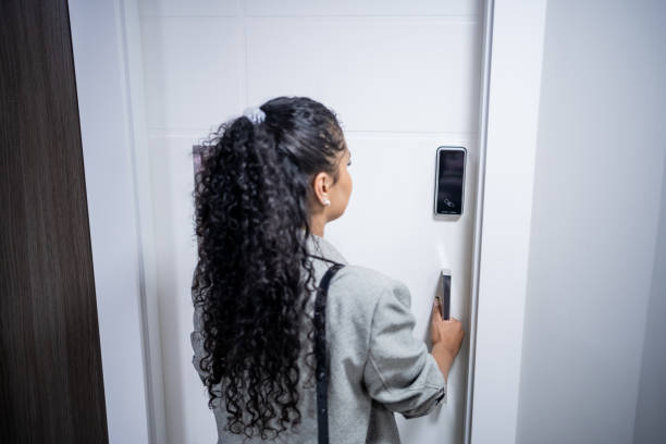 istock Woman using electronic card to open the door 1448382315