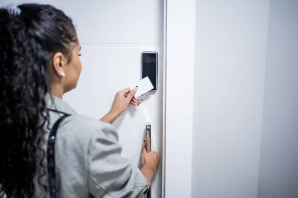 istock Woman using electronic card to open the door 1448382348