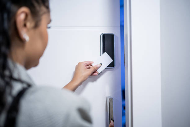 istock Woman using electronic card to open the door 1448382357