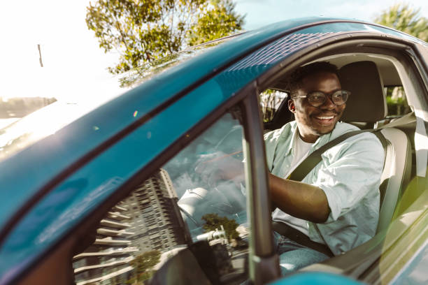 istock Cheerful male driver in the car 1448383183