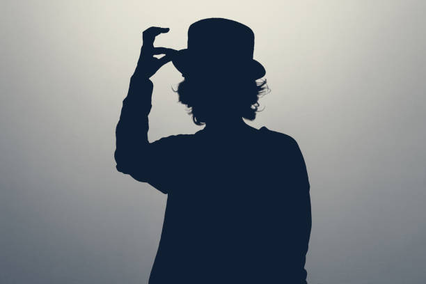 istock Unknown female person silhouette in studio. Stay anonym, hide identity. 1448383215