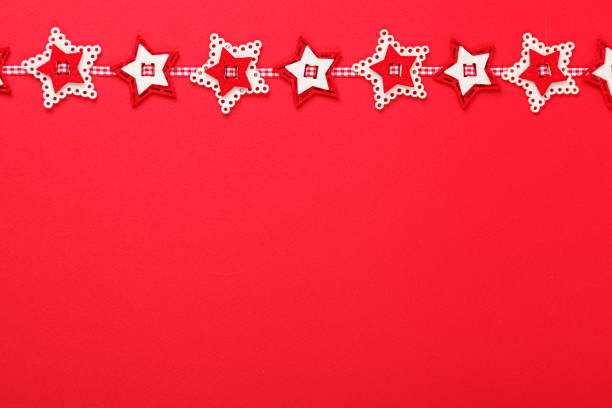 Christmas garland on a red background close-up