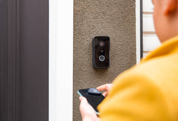 istock Woman using a phone to enter an office 1448384614