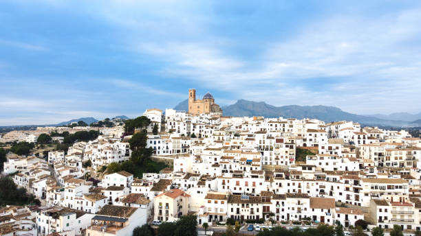 Aerial image of the town of Altea in Alicante (Spain) with its typical white houses with its church in the center of the image famous for its dome. Mediterranean culture stock photo