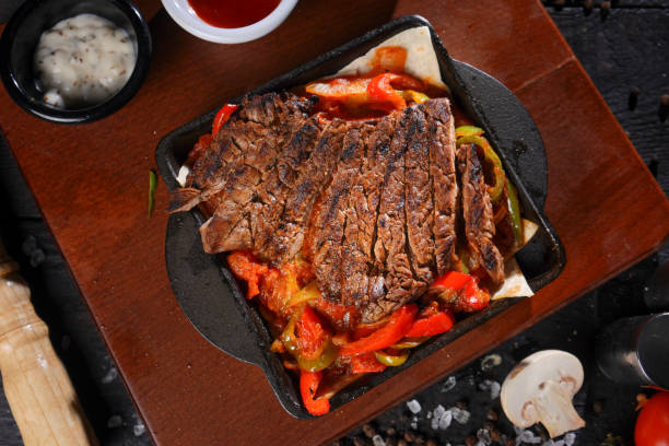 istock Steak grill on a cutting board with rosemary. 1448384674