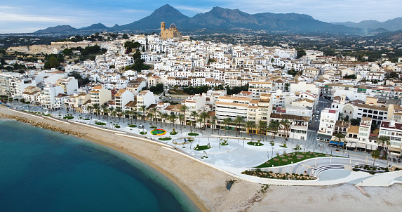 Altea, Spain - December 07, 2022: Aerial view of the new park in the beach of the town of Altea in Alicante, Spain with its famous church in background