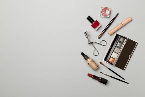 istock Different makeup products on color background, top view 1448384743