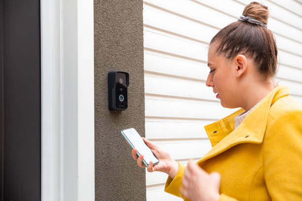 istock Woman using a phone to enter an office 1448384864