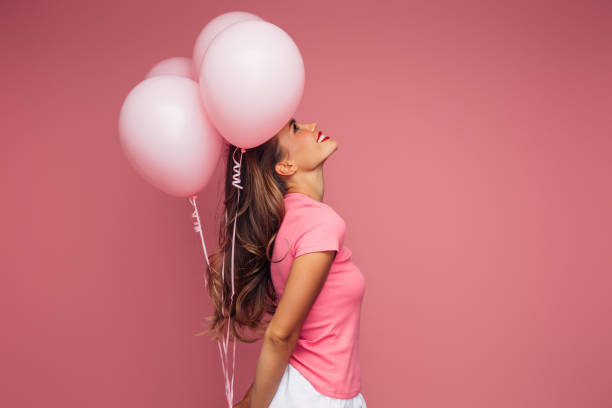 Happy beautiful woman with balloons stock photo