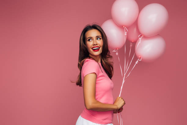 istock Happy beautiful woman with balloons 1448387199