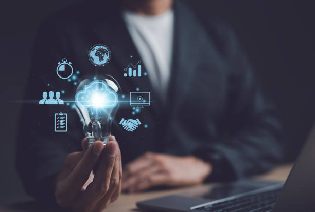 istock Businessman hand holding creative light bulb with icons global Internet connection on plan strategy, Business connection application technology and digital marketing, Financial and banking, big data, 1448388434