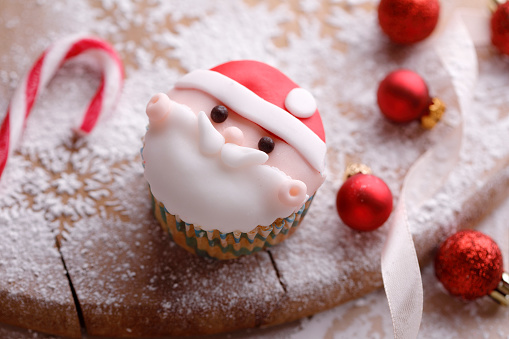 Santa cupcake with christmas ornaments