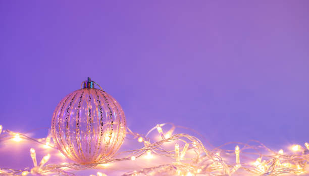 istock Christmas tree ball and garland in neon light isolated, copy space. 1448389308