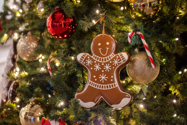 istock christmas tree for christmas with a garland and with decorations and with a gingerbread man 1448389310