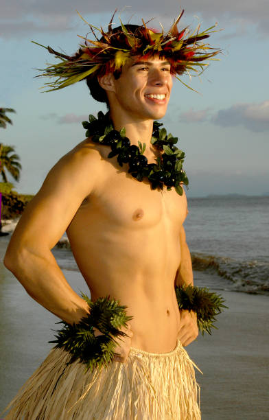 istock A smiling male hula dancer poses on the beach. 1448389468