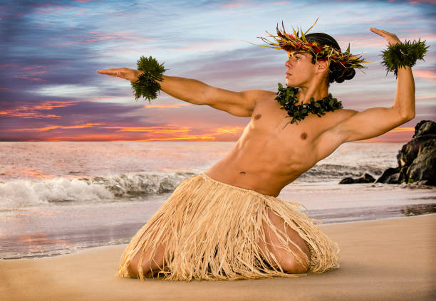 istock Male Hula dancer performs on the beach at sunset 1448389478