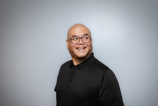 Studio Portrait - Asian Man - Soft Grey Background - Positive Emotion - Black Shirt