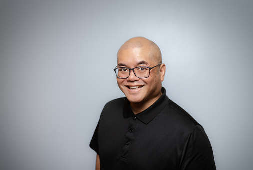 Studio Portrait - Asian Man - Soft Grey Background - Positive Emotion - Black Shirt