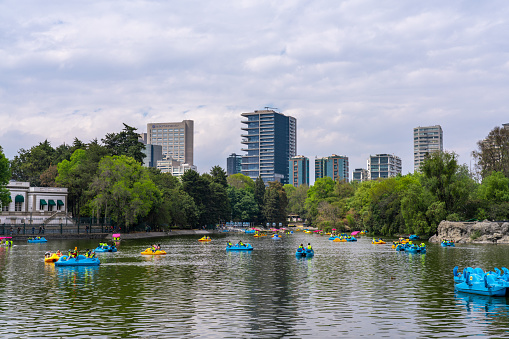 Mexico City, Mexico - February 13 2022: People in Pedal boats in Chapultepec Lake Mexico City