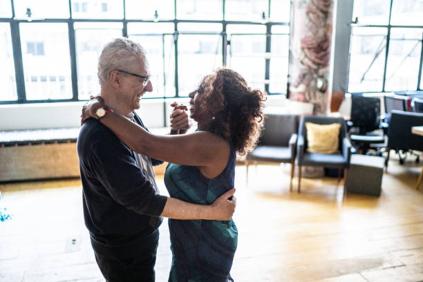 istock Senior couple dancing waltz in dance hall 1448395053