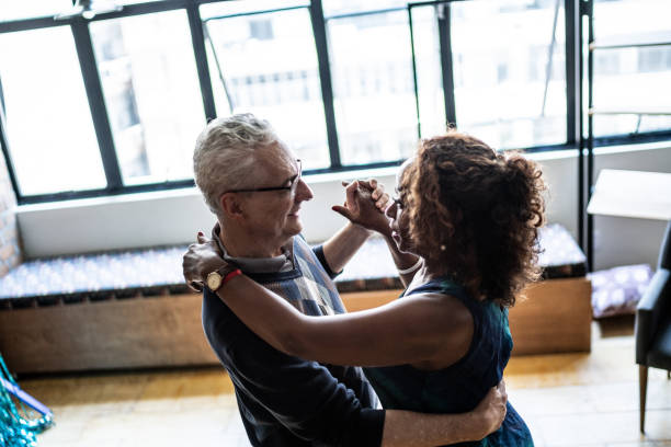 istock Senior couple dancing waltz in dance hall 1448395107