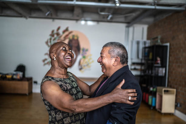 istock Senior couple dancing waltz in dance hall 1448395785