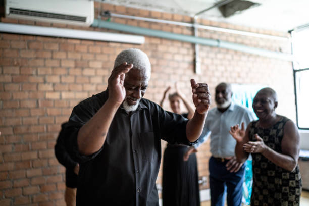 istock Senior man dancing with his friends on a dance hall 1448396054
