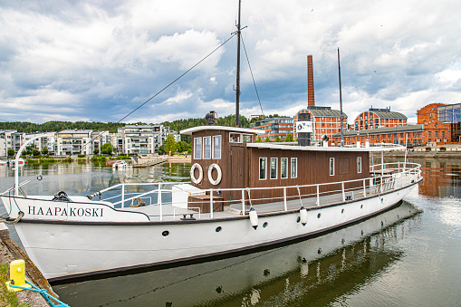 August, 2022. Lahti, Finland.  Harbour of Lahti. Sibelius concert hall and old factory in the background.