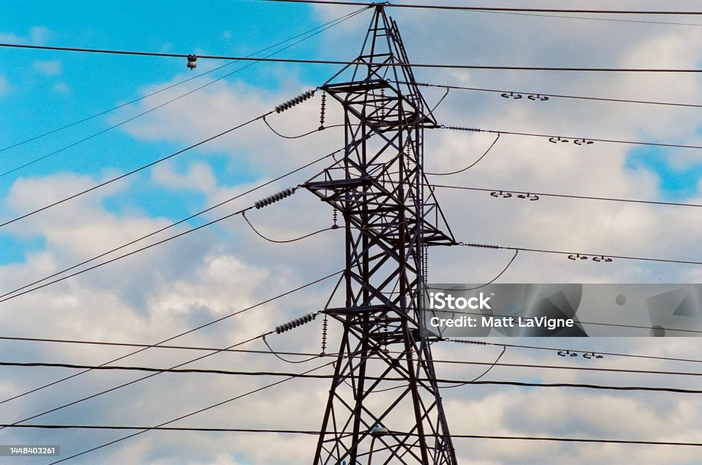 Beautiful composition of hydro Tower and lines in front of the blue & cloudy sky Beautiful composition of hydro Tower and lines in front of a blue and cloudy sky Beauty Stock Photo
