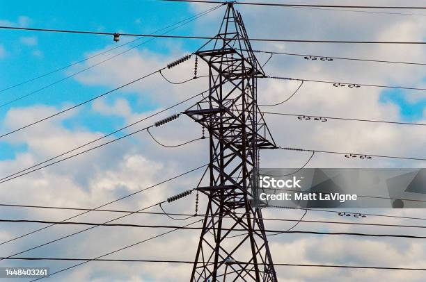 Beautiful Composition Of Hydro Tower And Lines In Front Of The Blue Cloudy Sky Stock Photo - Download Image Now