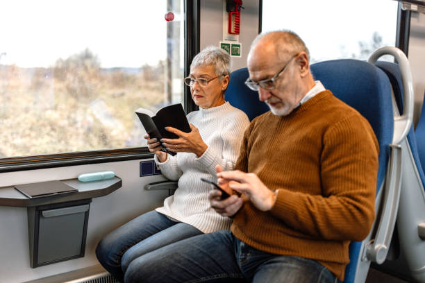 istock Senior couple enjoying train ride 1448407601