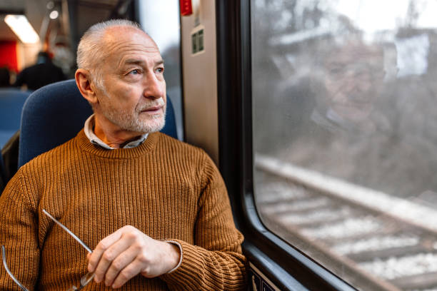 istock Active senior man traveling by train 1448407662