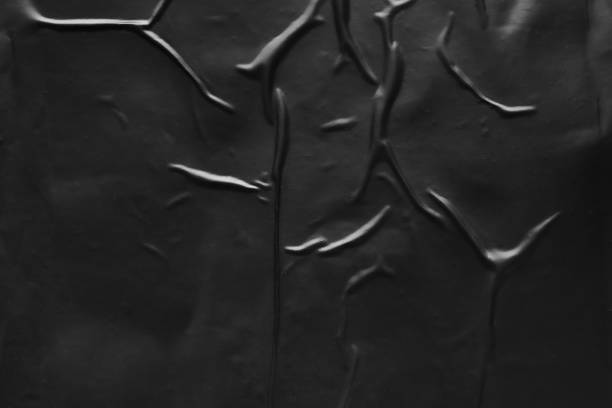 istock black crumpled and creased plastic poster texture background 1448408443
