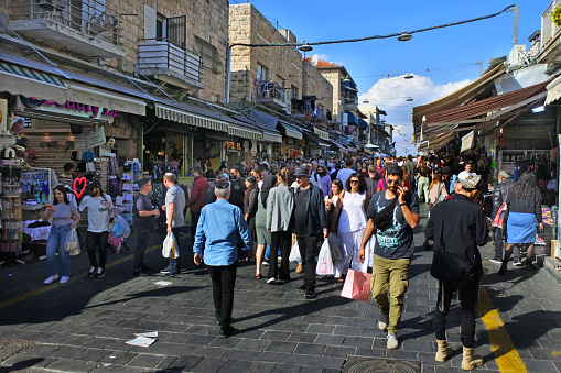 Jerusalem - Nov 11 2022:Israeli people shopping at Mahane Yehuda Market on a busy Friday.The market is popular with locals and tourists alike with more than 250 vendors sell fresh food and other goods