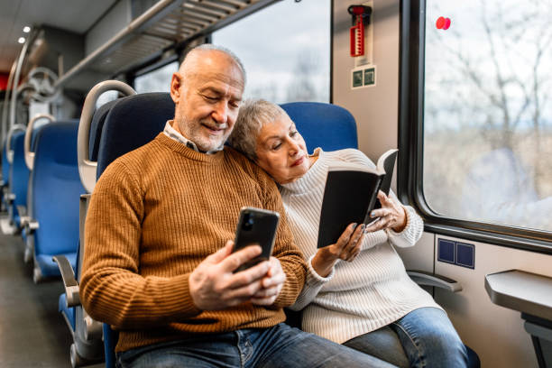 istock Senior couple enjoying long ride while napping and reading book 1448408693
