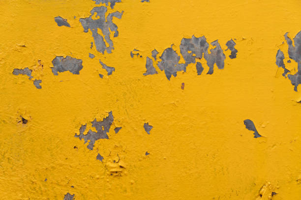 istock Yellow steel plate, rough surface, peeling paint, showing rusty steel texture.  abstract background. 1448409538