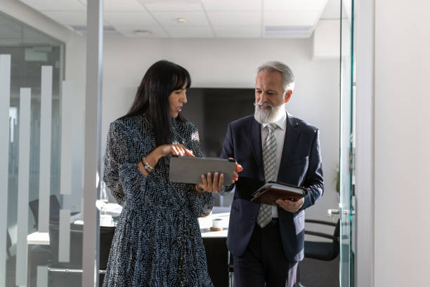 istock Formal talk between director and woman in office 1448409876