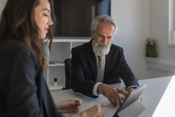 istock Formal talk between director and woman in office 1448409885