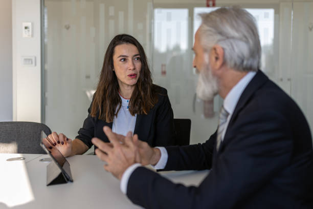 istock Formal talk between director and woman in office 1448409886