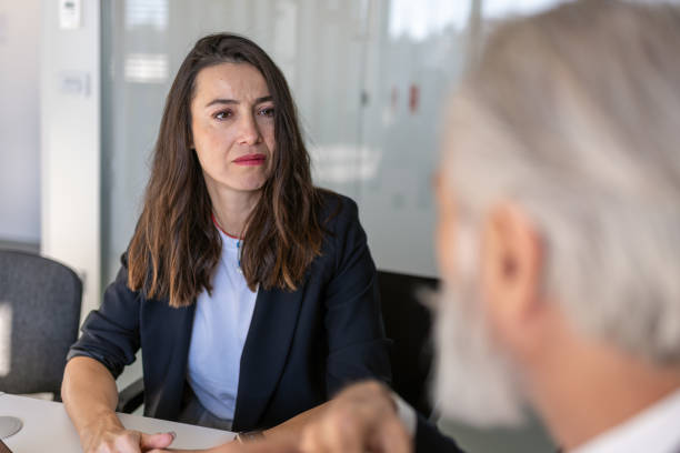 istock Formal talk between director and woman in office 1448409893