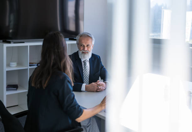 istock Formal talk between director and woman in office 1448409898