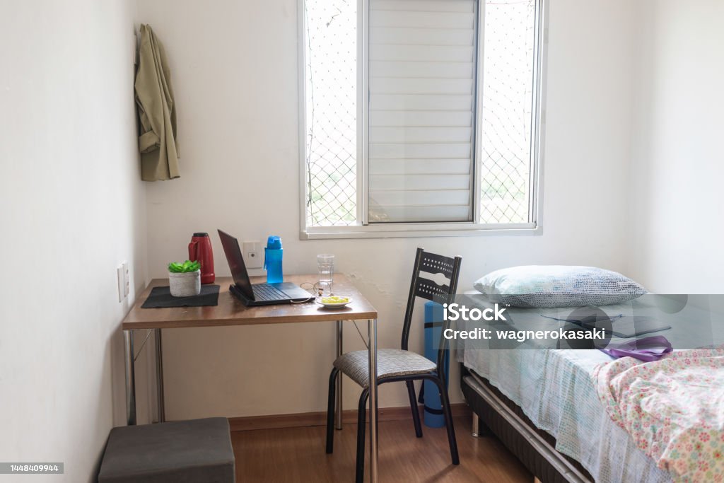 Simple bedroom with an adapted corner to video calls View of a simple bedroom with an adapted corner to video calls. Nobody is there Home Office Stock Photo
