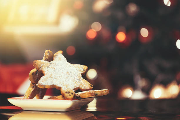 istock christmas cookies for santa on a defocus christmas tree background 1448412964