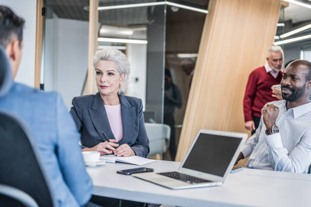 istock Group of people in a modern office having a meeting 1448413651